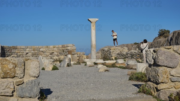 Ancient ruins with a medium-sized column and blue sky in the background, Agios Stefanos Beach, Agios Stefanos Basilica, Agios Nikolaos Chapel, Kastri Island, Kos, Dodecanese, Greek Islands, Greece