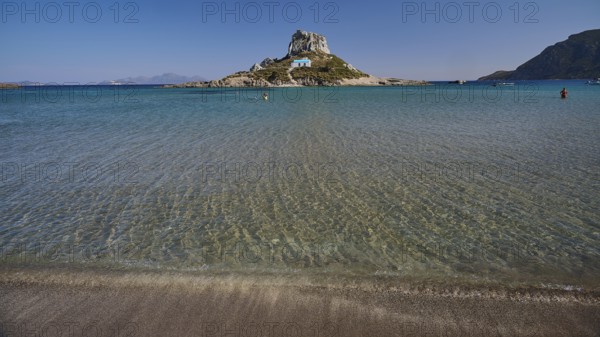 Clear blue sea with peaceful island in the centre of the picture, Agios Stefanos Beach, Agios Stefanos Basilica, Chapel Agios Nikolaos, Kastri Island, Kos, Dodecanese, Greek Islands, Greece