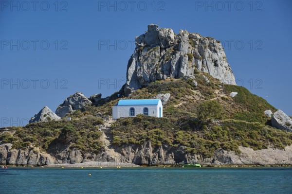 Top of a rocky island with chapel and blue roof, Agios Stefanos Beach, Agios Stefanos Basilica, Chapel of Agios Nikolaos, Kastri Island, Kos, Dodecanese, Greek Islands, Greece