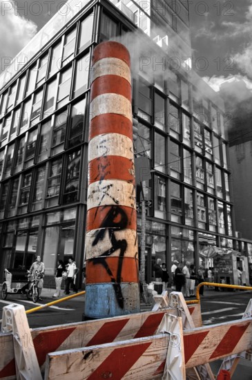 Steaming chimney at a construction site, behind a skyscraper, New York City, USA