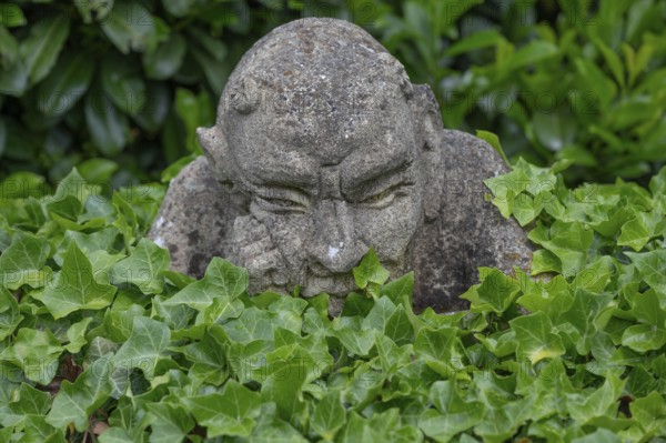 Stone sculpture, grotesque in a garden, Bavaria, Germany