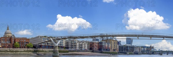 UK, London. Millennium Bridge and Downtown financial business district panorama skyline