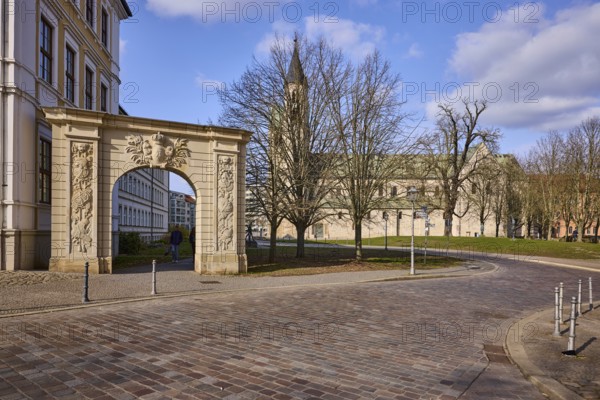 Stargate at the cathedral square, archway, bollards, monastery, church, bare winter trees, baroque architectural style, blue sky, cumulus clouds, cathedral square, government road, Magdeburg, state capital, independent city, Saxony-Anhalt, Germany
