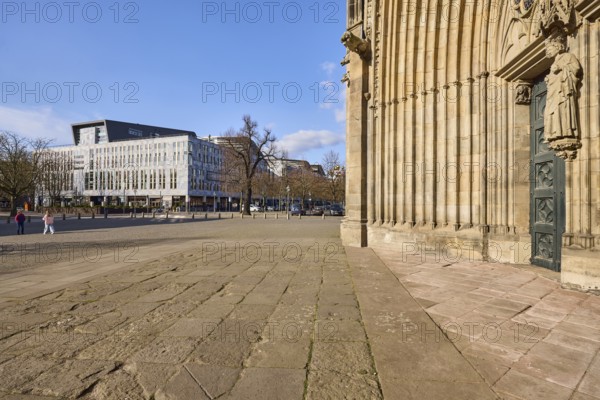 Magdeburg Cathedral, entrance, modern architecture, bare winter trees, pavement made of sandstone slabs, frog perspective, blue sky, cumulus clouds, square, Am Dom, Magdeburg, state capital, independent city, Saxony-Anhalt, Germany