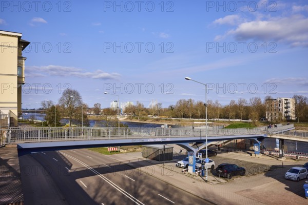 Pedestrian bridge, river Elbe, lantern, general architecture, bare wintry trees, blue sky, cumulus clouds, Fürstenwallsteg, street Schleinufer, Magdeburg, state capital, independent city, Saxony-Anhalt, Germany