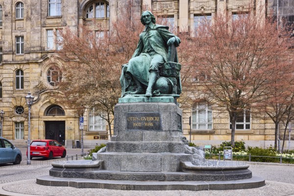 Monument to Otto von Guericke, sandstone building, public order office, bare winter trees, parking lane with vehicles, old town, street Bei der Hauptwache, Magdeburg, state capital, independent city, Saxony-Anhalt, Germany