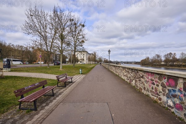River Elbe, riverside promenade, lantern, benches, sandstone wall, bare wintry trees, general architecture, diffuse light, blue sky, cumulus clouds, banks of the river Schlein, Magdeburg, state capital, independent city, Saxony-Anhalt, Germany