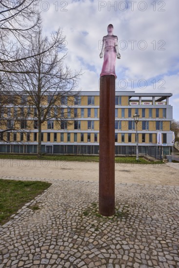 Mechthild von Magdeburg, sculpture, transparent plastic, sculptor Susan Turcot, lawn, bare winter trees, pavement made of cobblestones, general architecture, diffuse light, cloudy, Fürstenwall, Magdeburg, state capital, independent city, Saxony-Anhalt, Germany