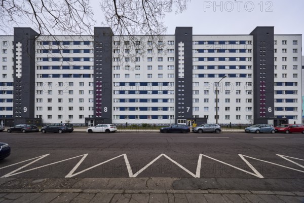 High-rise building, residential building, residential silo, façade with windows, colour line marking, zigzag line, diffuse light, cloudy, Salvador-Allende-Straße, Magdeburg, state capital, independent city, Saxony-Anhalt, Germany