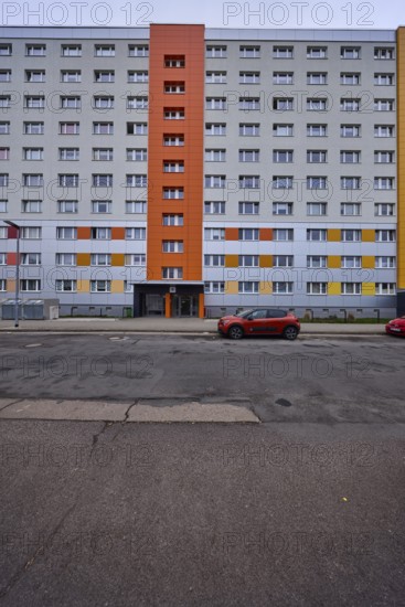 High-rise buildings, residential buildings, residential silos, facade, window, car park with vehicles, lantern, diffuse light, cloudy, Pablo-Neruda-Straße, Magdeburg, state capital, independent city, Saxony-Anhalt, Germany