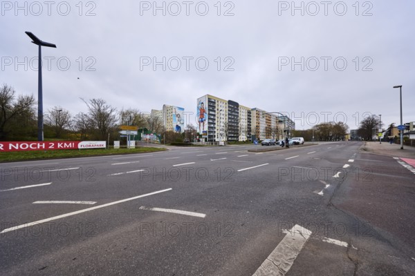 High-rise buildings, residential buildings, residential silos, lantern, asphalt road, lane markings, diffuse light, cloudy, intersection Ebendorfer Chaussee with access to Magdeburger Ring, Magdeburg, state capital, independent city, Saxony-Anhalt, Germany