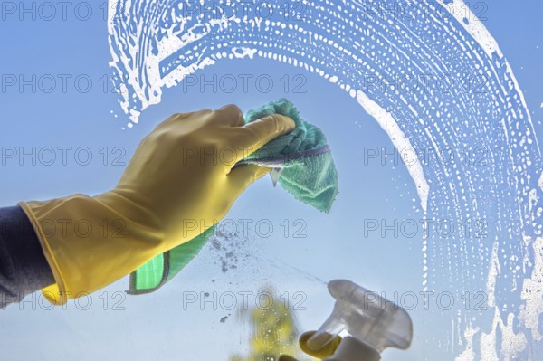Glass cleaning: Close-up of a window pane being cleaned