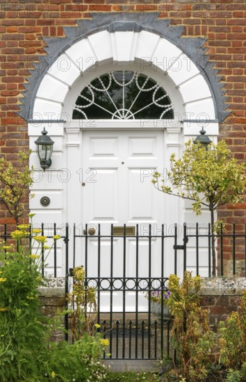 Historic Georgian style house door arched doorway with fanlight, Salisbury, Wiltshire, England, UK