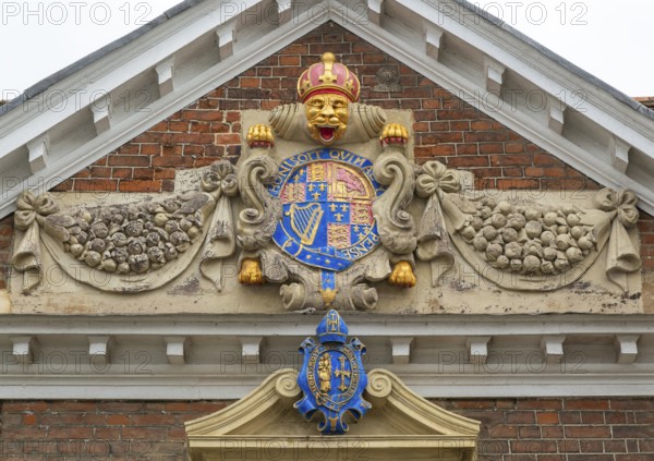 Royal Coat of Arms architectural detail, College of Matrons building, Salisbury, Wiltshire, England, UK 1682