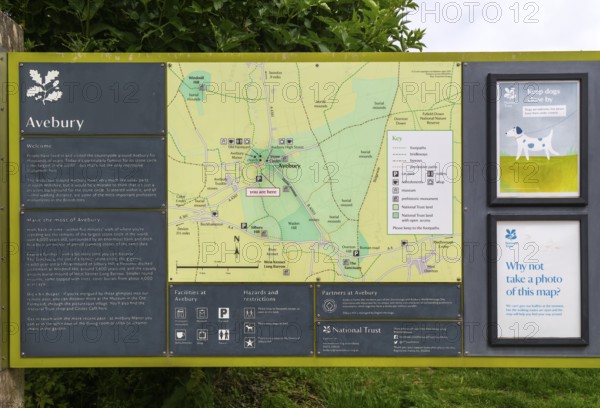 Information board with map at prehistoric stone circle site at village of Avebury, Wiltshire, England, UK