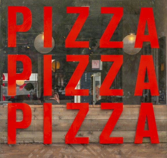 Pizza PIzza Pizza sign restaurant window, nole on the square, Salisbury, Wiltshire, England, UK