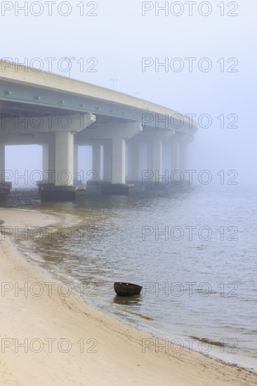 US Highway 90 bridge over the Biloxi Bay disappears into the dense fog at Ocean Springs, Mississippi