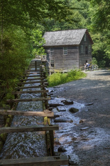 Wooden chute carries water to Mingus Mill to power grist mill for grinding corn in Great Smoky Mountains National Park near Cherokee, North Carolina