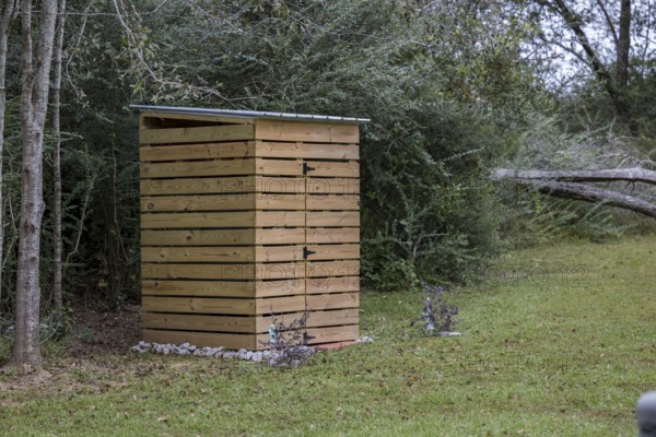 Wooden shelter around well pump in Gulfport, Mississippi