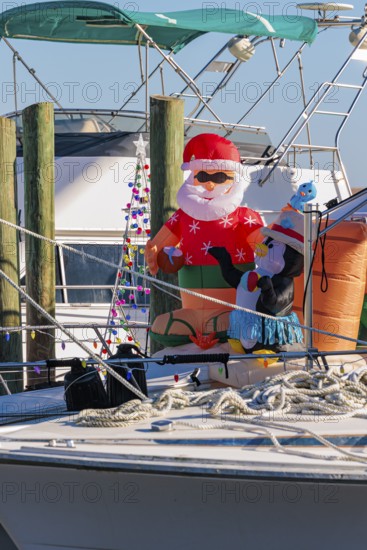 Inflatable Christmas decorations on the deck of a boat at the Biloxi Small Craft Harbor in Biloxi, MS