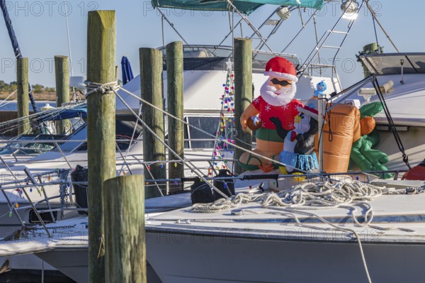 Inflatable Christmas decorations on the deck of a boat at the Biloxi Small Craft Harbor in Biloxi, MS