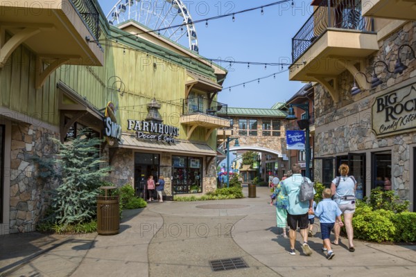 Family walking through shopping area of The Island recreation center in Pigeon Forge, Tennessee