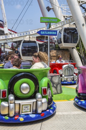 Tourists riding the Funny Cars ride at The Island recreation center in Pigeon Forge, Tennessee