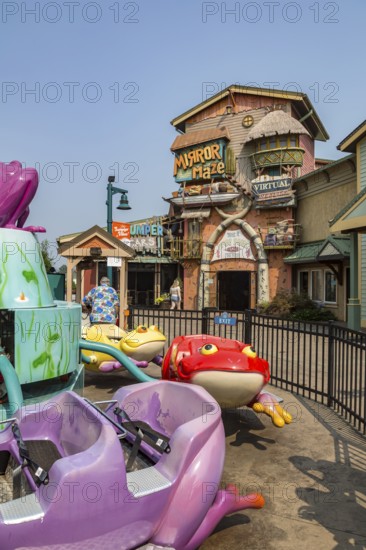 Mirror Maze attraction behind the Lil' Ribbits frog kiddie ride at The Island recreation center in Pigeon Forge, Tennessee