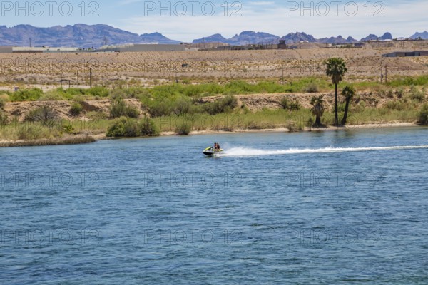 Tourists riding jet skis on the Colorado River in Laughlin, Nevada