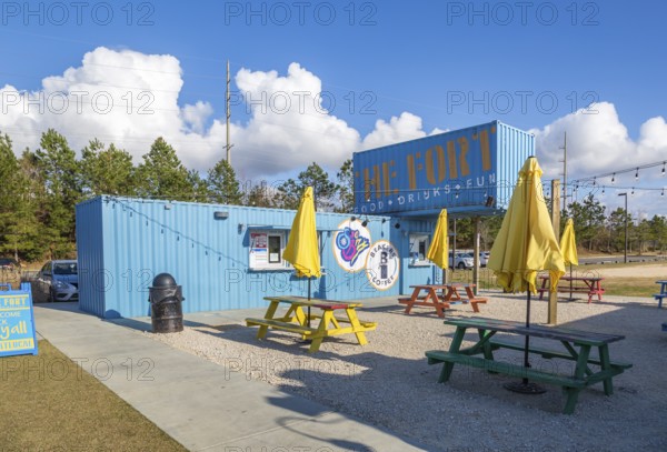 Breakers Coffee shop and Sno Biz are just two businesses within The Fort outdoor dining and entertainment hangout composed of repurposed shipping containers in Spanish Fort, Alabama, USA