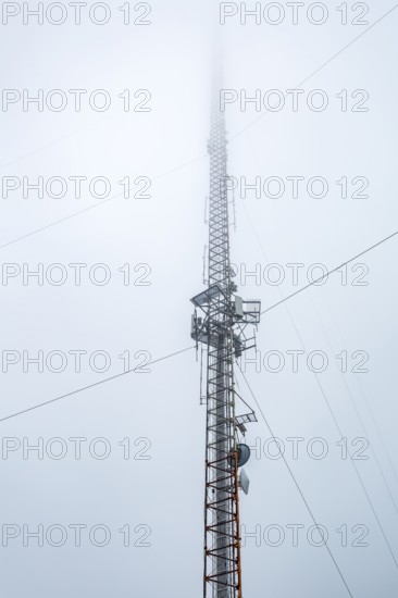 Cell tower extending into the clouds