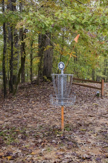 Disc golf basket on the course at Tombigbee State Park near Tupelo, Mississippi