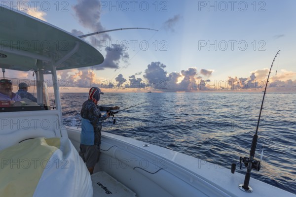 Offshore fishing in the Gulf of Mexico at sunset