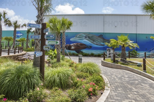 Sign directs guests to different attractions at Ocean Adventures Marine Park in Gulfport, Mississippi