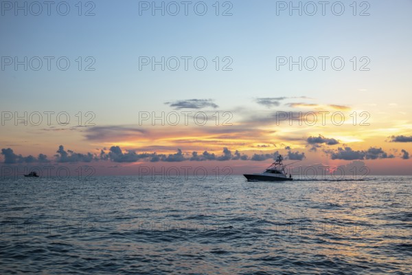 Offshore fishing boat in the Gulf of Mexico at sunset