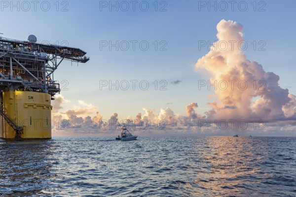 Private fishing boats near offshore petroleum drilling rig in the Gulf of Mexico