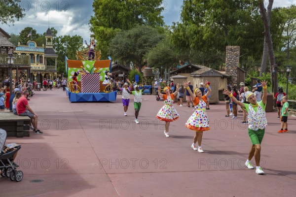 Parade of dancers and characters in the Frontierland area of Magic Kingdom at Walt Disney World, Orlando, Florida