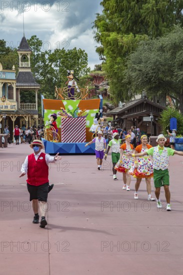Parade of dancers and characters in the Frontierland area of Magic Kingdom at Walt Disney World, Orlando, Florida