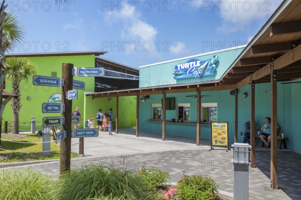 Sign outside the Turtle Cafe directs guests to different attractions at Ocean Adventures Marine Park in Gulfport, Mississippi