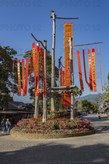 Lanna flags display celebrates cultural history inside the Doi Tung tourist attraction in Chiang Rai, Thailand