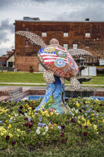 Military themed Sea Turtle statue painted by artist James Priddy in downtown Milton, Florida