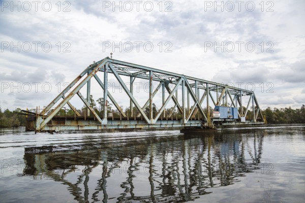 Old CSX railroad through truss swing bridge over the Blackwater river in Milton, Florida