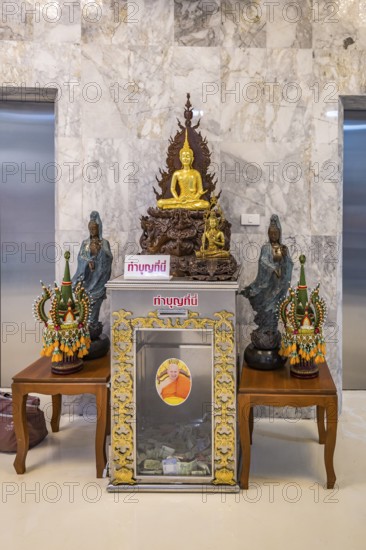 Buddahist shrine inside the Guan Yin (Goddess of Mercy) statue at Wat Huay Pla Kang Temple in Chiang Rai province of Northern Thailand