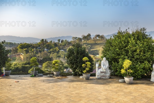 Statue at base of the Guan Yin (Goddess of Mercy) statue at Wat Huay Pla Kang Temple in Chiang Rai province of Northern Thailand