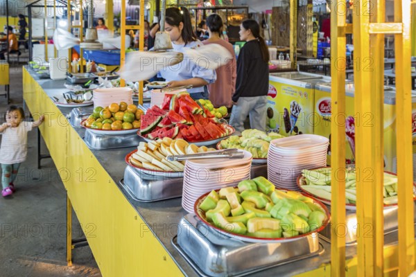 Selection of fresh fruits available for customers at a buffet style outdoor restaurant in Chiang Rai province of Northern Thailand