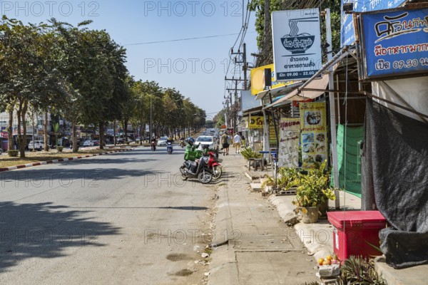 Retail businesses and street food shops along Ban Du street in Chiang Rai, Thailand