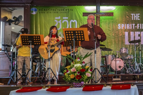 Pastor Michael Johnson speaking at the Baan Athitaan Church and Grace Language School in Chiang Rai, Thailand