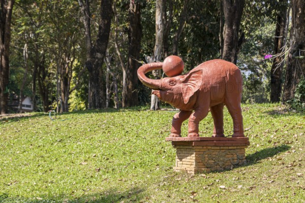Statue of an elephant with a ball on the campus of CRRU Shiangrai Rajabhat University in Chiang Rai, Thailand