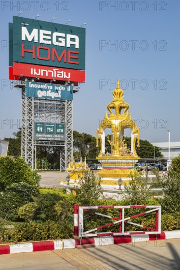 Buddahist shrine outside of the Mega Home building materials warehouse store in Chiang Rai province of Northern Thailand