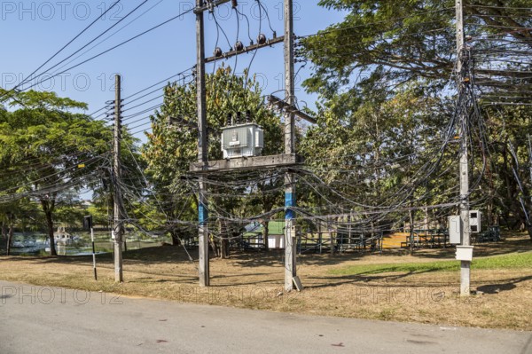 Tangled mess of utility lines on the campus of CRRU Shiangrai Rajabhat University in Chiang Rai, Thailand